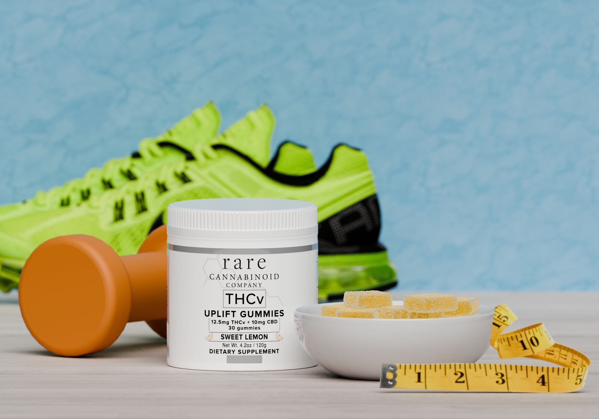 THCV Gummies with a weight, running shoes, and tape measure 